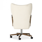 A comfort-driven desk chair features soft, textural upholstery, framed by solid ash arms. A height-adjustable swivel base with casters makes for ease in the modern office. Amethyst Home provides interior design, new home construction design consulting, vintage area rugs, and lighting in the Austin metro area.