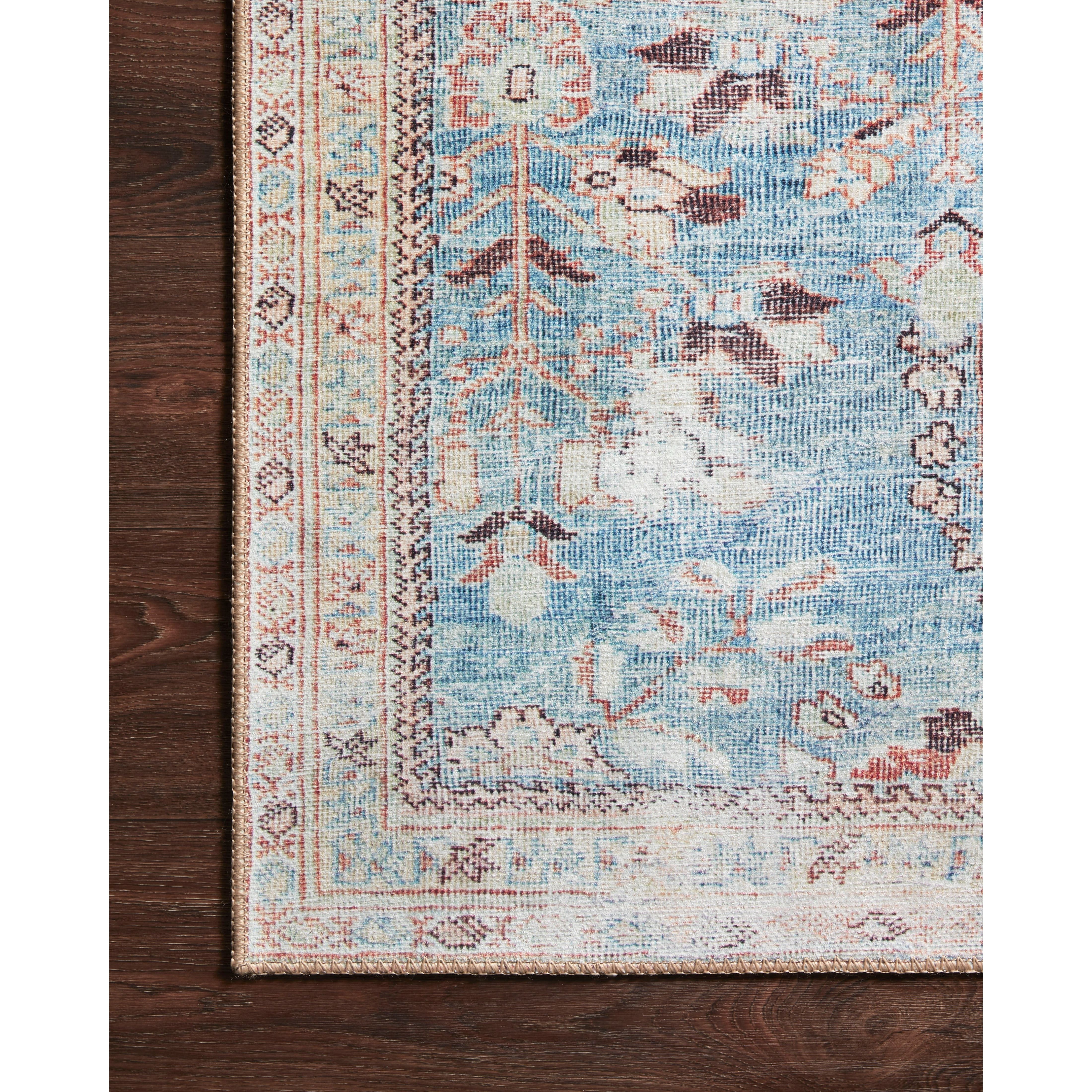 The Wynter Teal / Multi area rug showcases a one-of-a-kind vintage or antique area rug look power-loomed of 100% polyester. This rug brings in tones of blue, ivory, and pink. The rug is ideal for high traffic areas due to the rug's durability for living rooms, dining rooms, kitchens, hallways, and entryways.