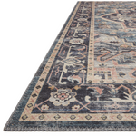 Featuring soft motifs in a carefully curated color palate of black, blue, yellow, and hints of orange, the Hathaway Navy / Multi area rug captures the essence of one-of-a-kind vintage or antique area rug at an attractive price.