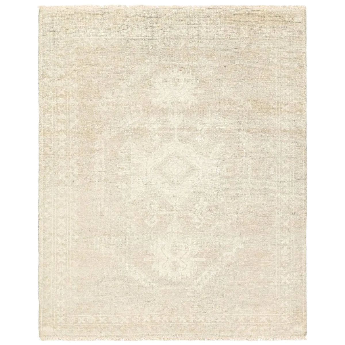 Hand carded wool, soft Tencel, and a neutral color palette define the handknotted Ashend Vavite. The Vavite rug showcases a Moroccan-inspired center medallion in a neutral cream and tan colorway. Geometric detailing establishes a thin border and provides a nod to the tribal styles of northern Africa. Amethyst Home provides interior design, new home construction design consulting, vintage area rugs, and lighting in the Des Moines metro area.